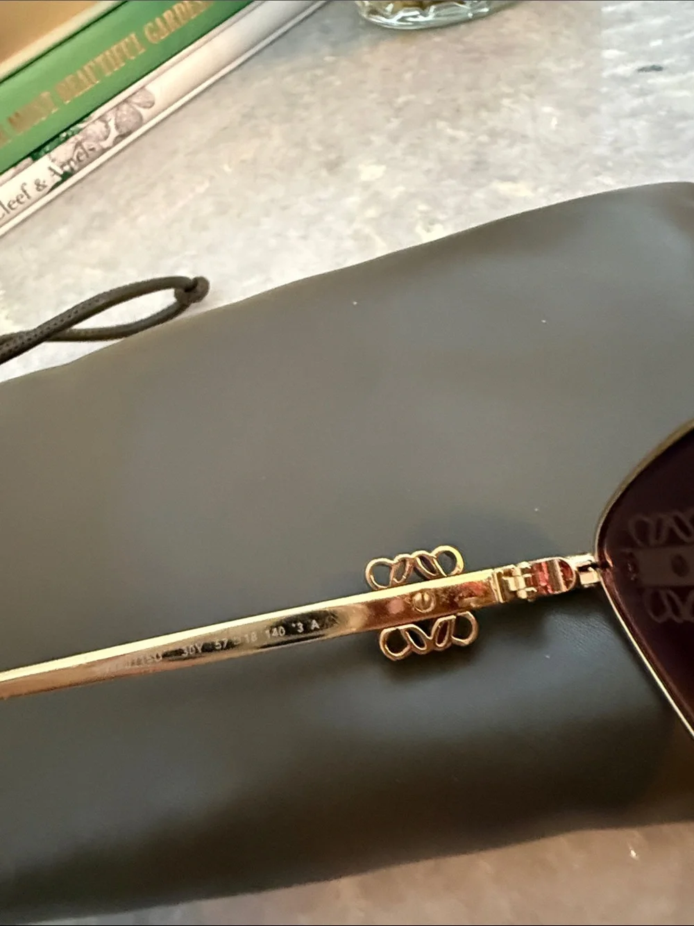Loewe Gold Frame Sunglasses with Dark Lenses